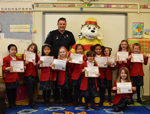 image of children and certificates with fire fighter
